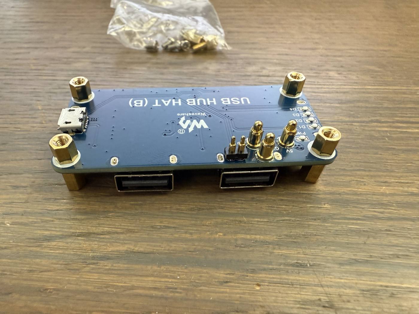 The USB hub HAT with its four copper standoffs screwed into place
