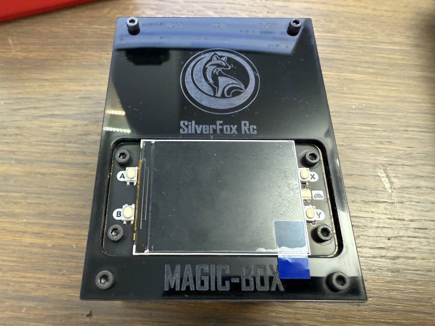 The finished Magic Box with the cut-out top plate fitted and the screen showing through the opening