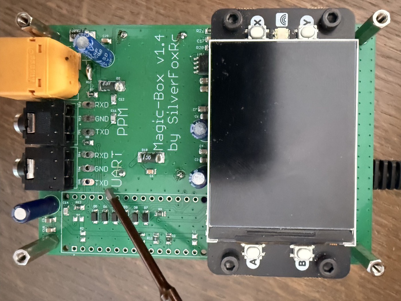 Magic Box PCB top view — UART and PPM blocks with their solder pads, both 3.5 mm jacks visible on the right edge
